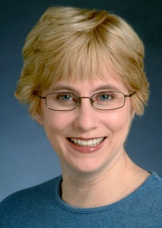 Headshot of a beautiful woman with glasses
