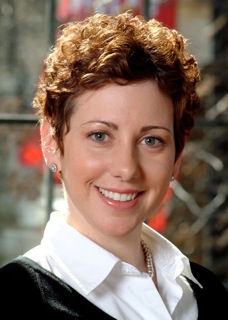 Headshot of a beautiful girl with short red hair